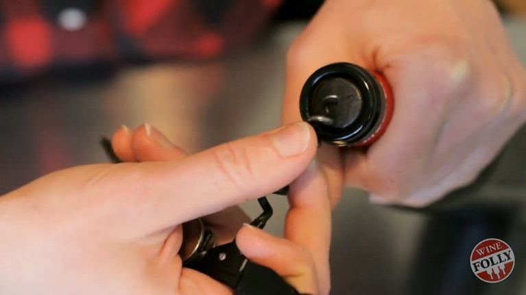 Insert corkscrew just off center so that the corkscrew is centered
