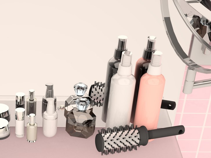 Pink wall and a shelf in the bathroom with hygiene accessories