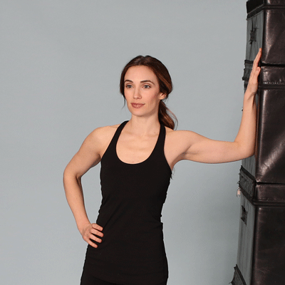 Wall stretch exercise gif.