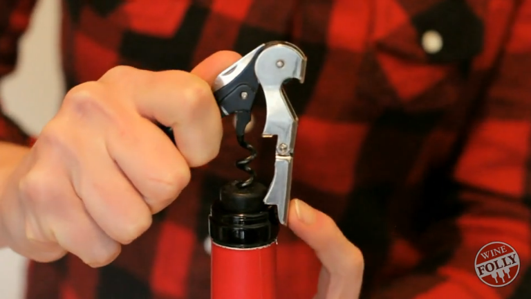 use lever to easily hoist cork out of bottle using hands at finish