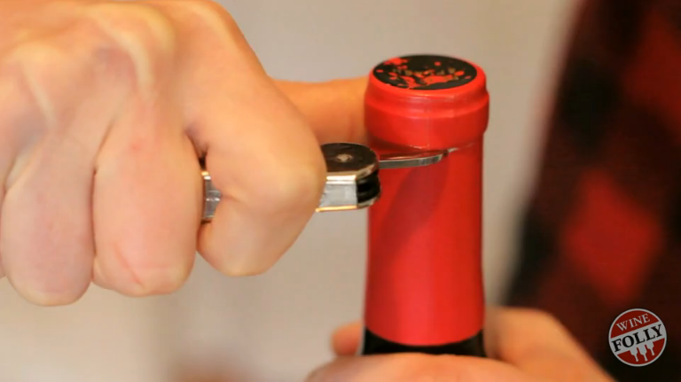 Cut foil below pour spout of bottle 