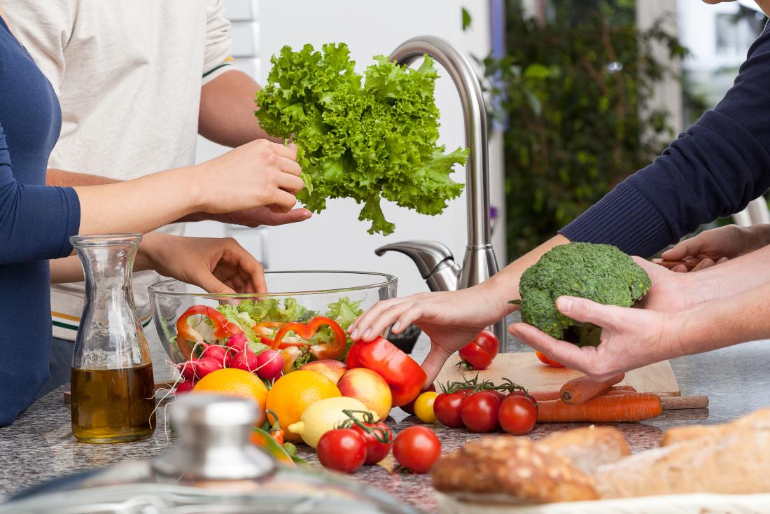 friends making a healthy salad