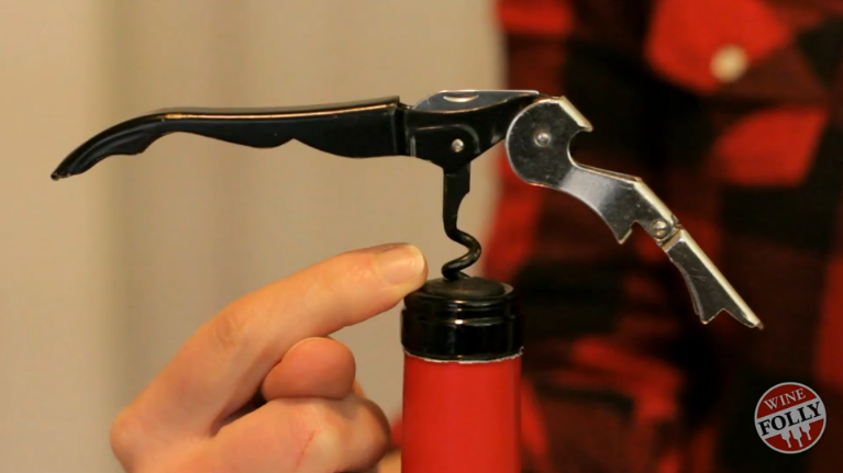 Insert corkscrew till o<em></em>nly 1 curl remains (or less)