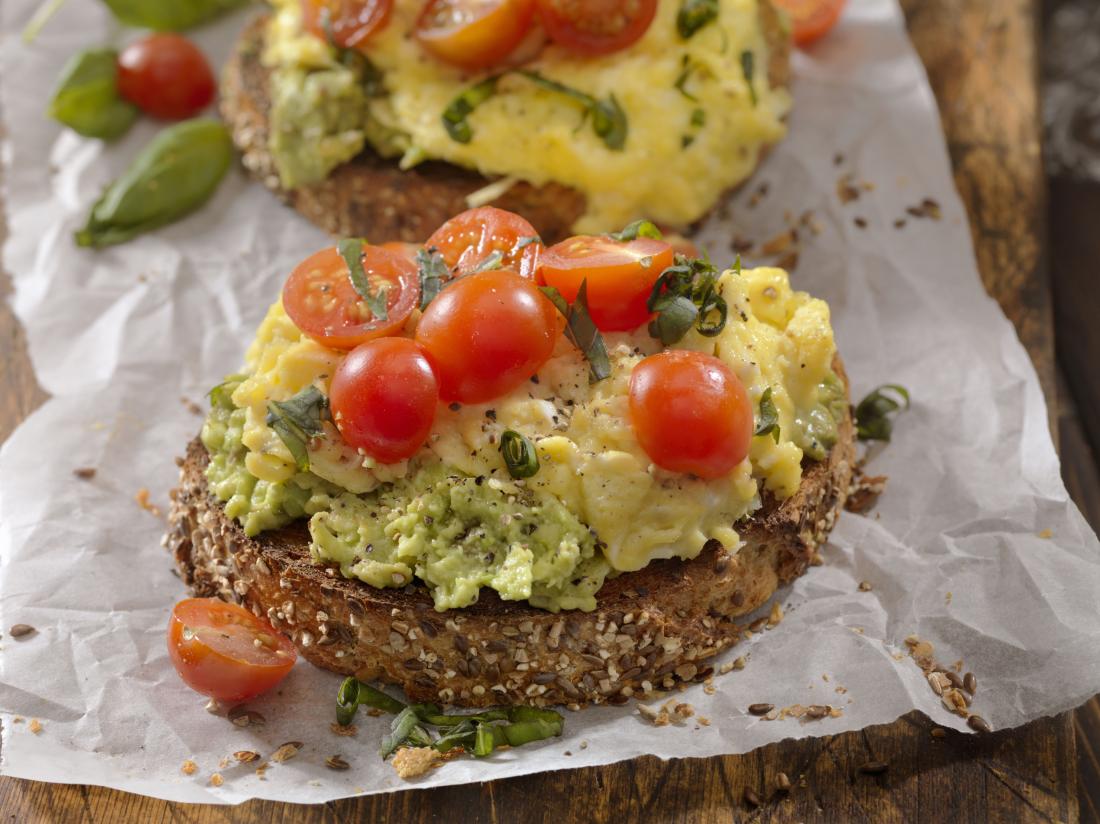 Scrambled eggs, avocado and tomatoes on whole grain bread which may be recommended for an adhd diet
