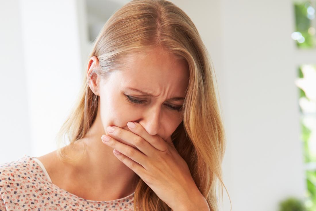 Woman feeling sick and nauseous because she accidentally ate maggots