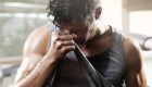 Man-Wiping-Sweat-With-Shirt