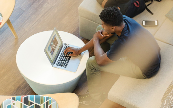 A man sitting in front of a computer