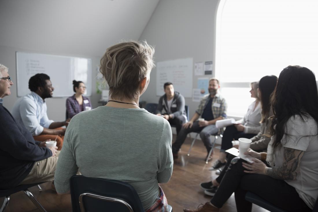 Group therapy or counseling session sitting in a circle.