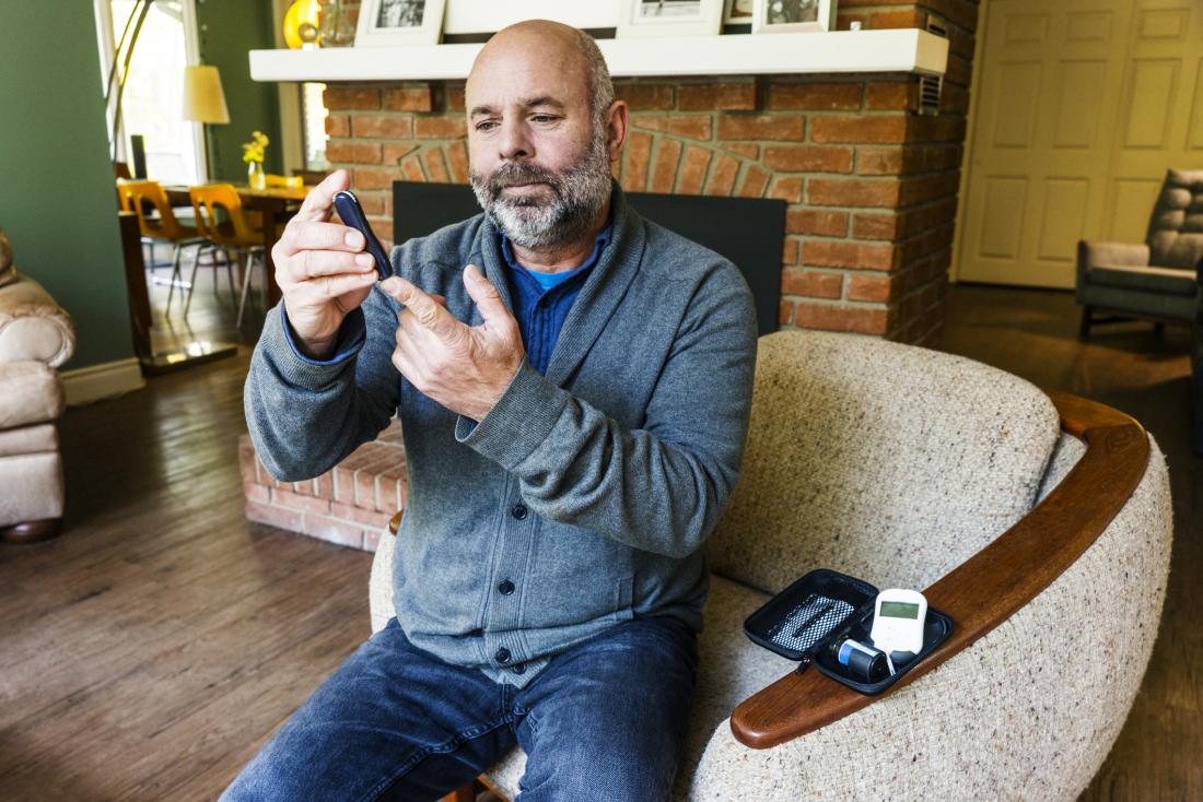 senior man checking blood sugar to prevent Diabetic ketoacidosis
