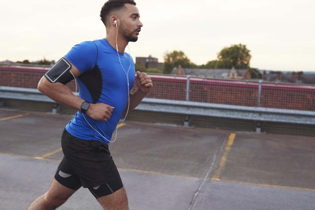 male athlete running on the road