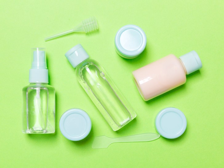 Set of travel sized cosmetics bottles.
